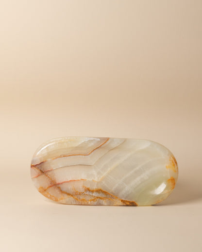 Onyx oval tray on a beige background